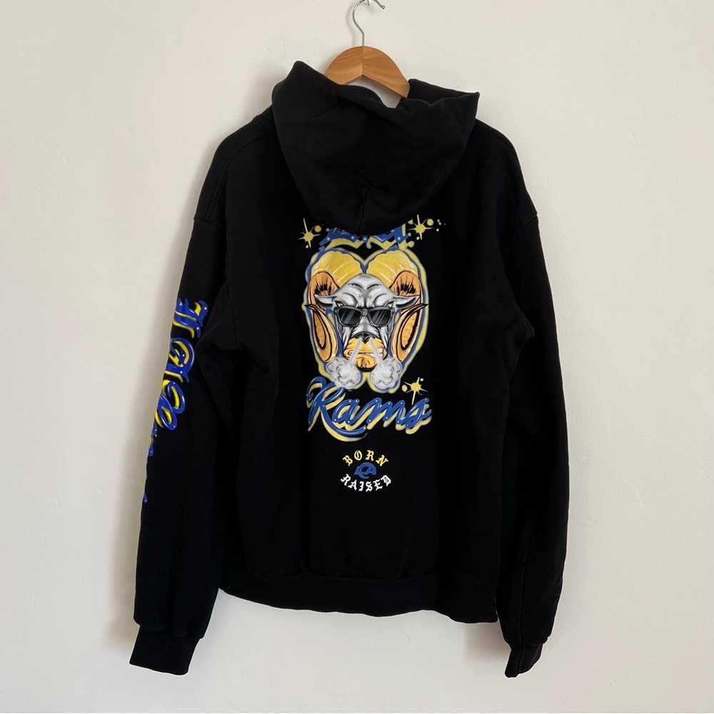 LA Rams Born x Raised Black Airbrushed Rampage Pullover Hoodie - Picture 8 of 9